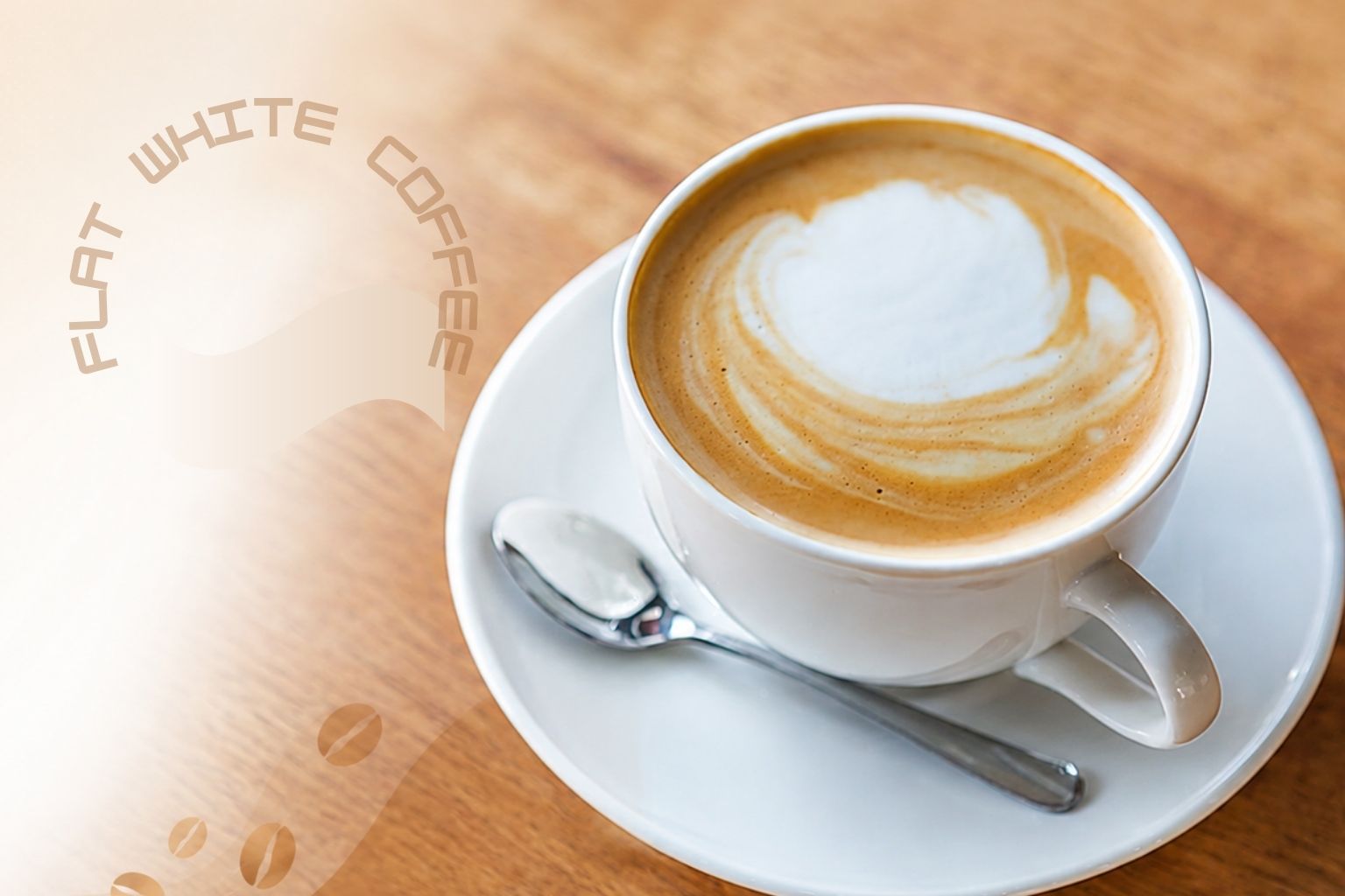 Flat White Coffee in a white cup with latte art on wooden table.